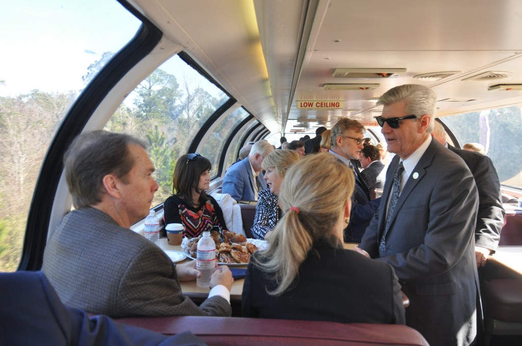 Mississippi Gov. Phil Bryant (right) talks to Gulfport Mayor Billy Hewes (left) and FRA Administrator Sara Feinberg (right of Hewes) on the Gulf Coast Inspection Train on February 18, 2016.