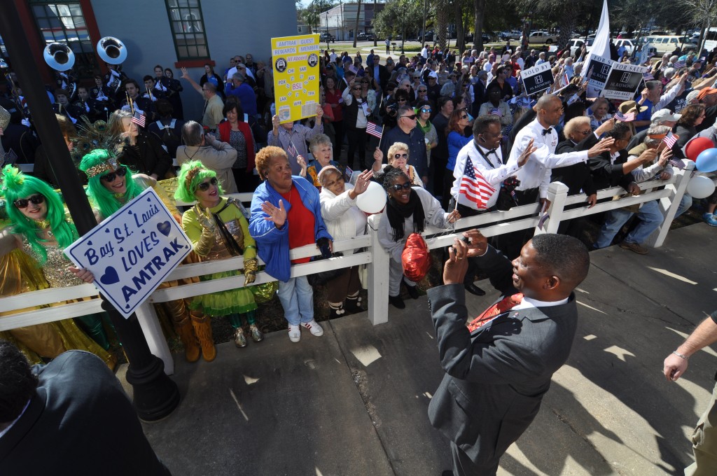 Shawn Wilson, Secretary of the Louisiana Department of Transportation and Development, takes photos of the crowd in Bay St. Louis, MS. 