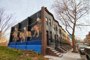 A mural on a rowhouse in the Station North neighborhood of Baltimore. Flickr photo by 