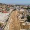 Bird's eye view of construction on a wide road in Los Angeles.