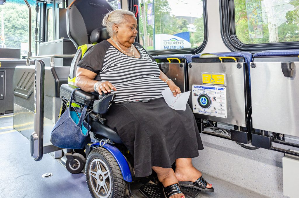 Person in a wheelchair inside a bus.