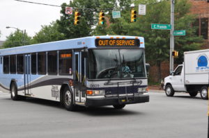 an out of service bus drives through an intersection
