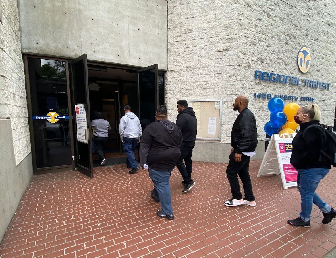 Prospective applicants line up for a Sacramento transit hiring event