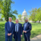 The three mayors smile broadly in front of the U.S. Capitol building in full suits (Monroe Mayor Friday Ellis sports a cowboy hat)