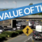 Still shot of a busy highway with the text "Value of Time" emblazoned across it on a blue banner
