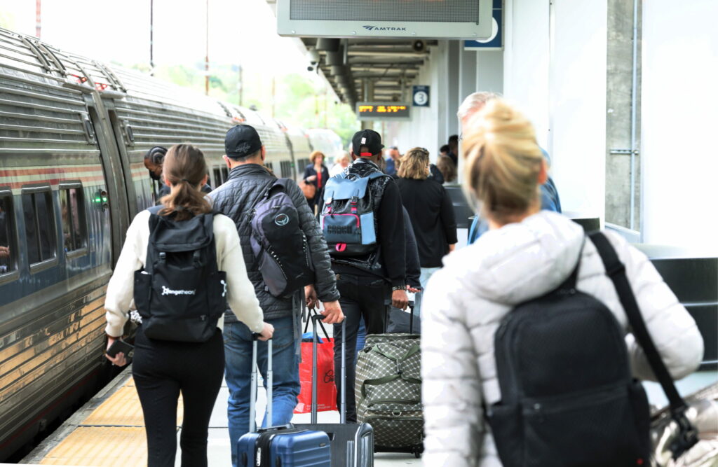 Passengers prepare to board an Amtrak train